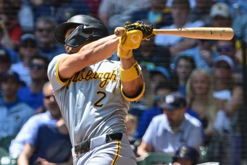 May 15, 2024; Milwaukee, Wisconsin, USA;  Pittsburgh Pirates first baseman Connor Joe (2) hits a sacrifice fly to drive in a run in the third inning against the Milwaukee Brewers at American Family Field. Mandatory Credit: Benny Sieu-USA TODAY Sports