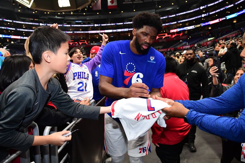 LOS ANGELES, CA - JANUARY 17: Joel Embiid #21 of the Philadelphia 76ers signs autographs after the game against the LA Clippers on January 17, 2023 at Crypto.Com Arena in Los Angeles, California. NOTE TO USER: User expressly acknowledges and agrees that, by downloading and/or using this Photograph, user is consenting to the terms and conditions of the Getty Images License Agreement. Mandatory Copyright Notice: Copyright 2023 NBAE (Photo by Adam Pantozzi/NBAE via Getty Images)