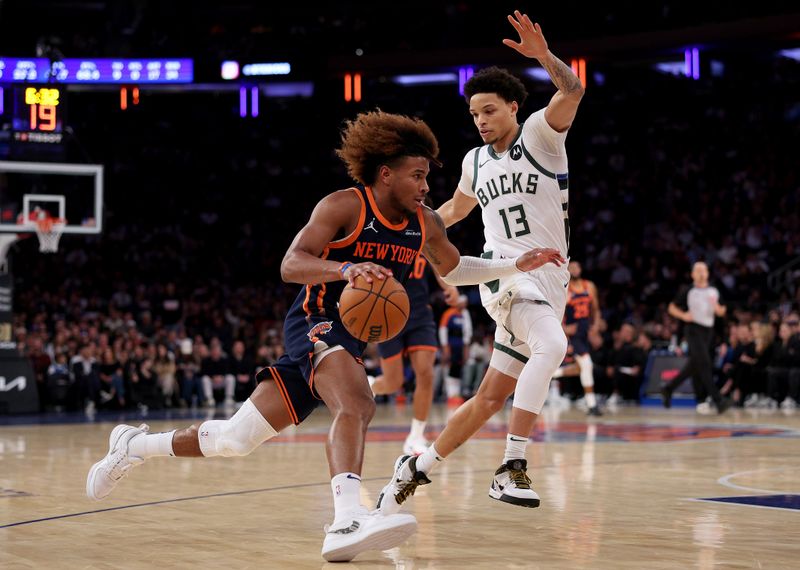 NEW YORK, NEW YORK - NOVEMBER 08:  Miles McBride #2 of the New York Knicks heads for the net as Ryan Rollins #13 of the Milwaukee Bucks defends at Madison Square Garden on November 08, 2024 in New York City. NOTE TO USER: User expressly acknowledges and agrees that, by downloading and or using this photograph, User is consenting to the terms and conditions of the Getty Images License Agreement. (Photo by Elsa/Getty Images)