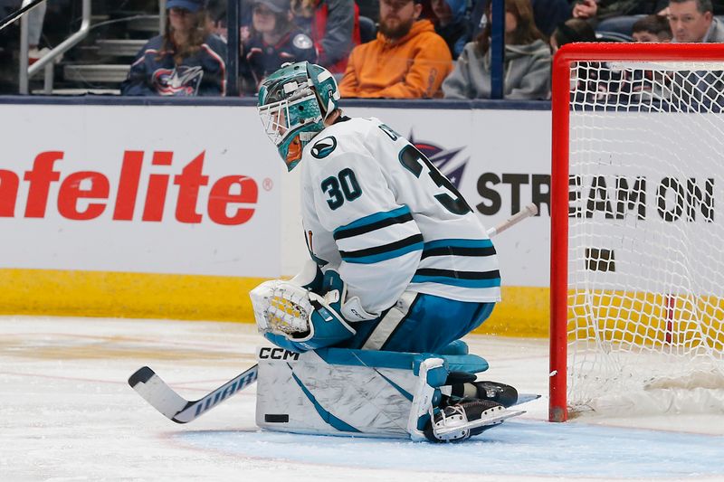 Mar 16, 2024; Columbus, Ohio, USA; San Jose Sharks goalie Magnus Chrona (30) makes a save against the Columbus Blue Jackets during the third period at Nationwide Arena. Mandatory Credit: Russell LaBounty-USA TODAY Sports