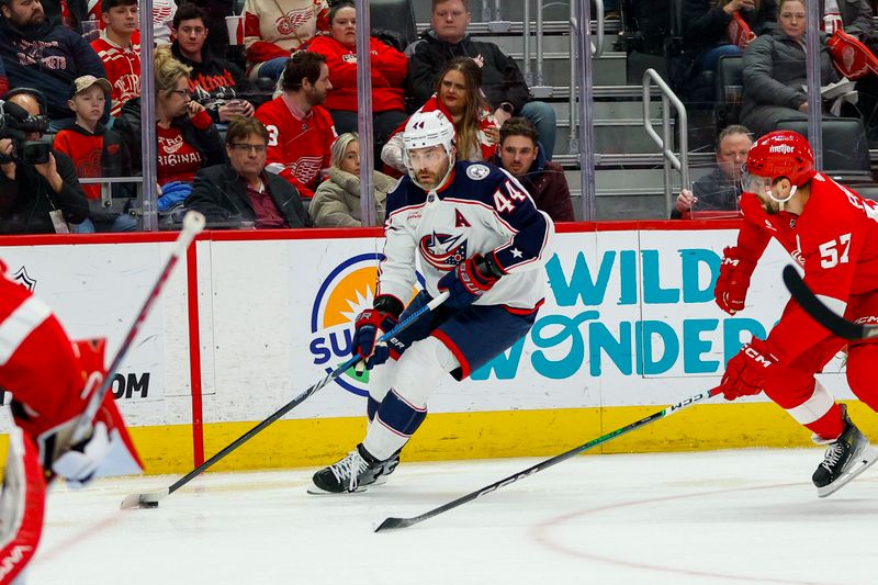 Mar 19, 2024; Detroit, Michigan, USA; Columbus Blue Jackets defenseman Erik Gudbranson (44) handles the puck during the first period of the game against the Detroit Red Wings at Little Caesars Arena. Mandatory Credit: Brian Bradshaw Sevald-USA TODAY Sports