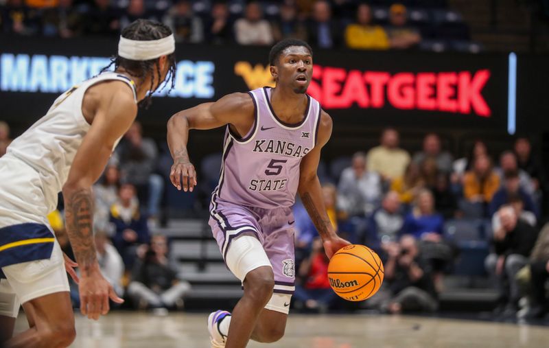 Jan 9, 2024; Morgantown, West Virginia, USA; Kansas State Wildcats guard Cam Carter (5) dribbles the ball during the first half against the West Virginia Mountaineers at WVU Coliseum. Mandatory Credit: Ben Queen-USA TODAY Sports