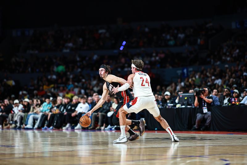 MEXICO CITY, MEXICO - NOVEMBER 02: Jaime Jaquez Jr. #11 of the Miami Heat dribbles against Corey Kispert #24 of the Washington Wizards during the second half of the game at Arena Ciudad de Mexico on November 02, 2024 in Mexico City, Mexico. NOTE TO USER: User expressly acknowledges and agrees that, by downloading and or using this photograph, User is consenting to the terms and conditions of the Getty Images License Agreement. (Photo by Manuel Velasquez/Getty Images)