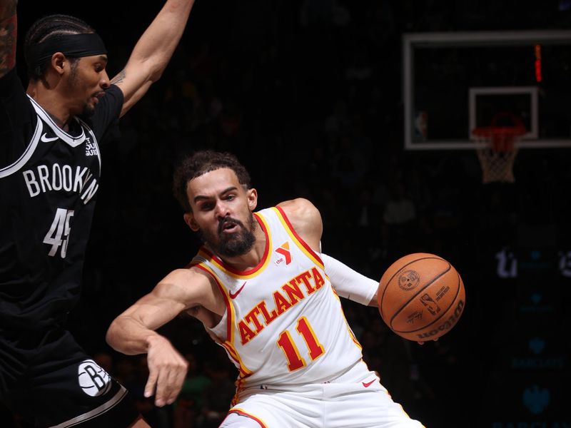 BROOKLYN, NY - MARCH 16: Trae Young #11 of the Atlanta Hawks dribbles the ball during the game against the Brooklyn Nets on March 16, 2025 at Barclays Center in Brooklyn, New York. NOTE TO USER: User expressly acknowledges and agrees that, by downloading and or using this Photograph, user is consenting to the terms and conditions of the Getty Images License Agreement. Mandatory Copyright Notice: Copyright 2025 NBAE (Photo by Nathaniel S. Butler/NBAE via Getty Images)
