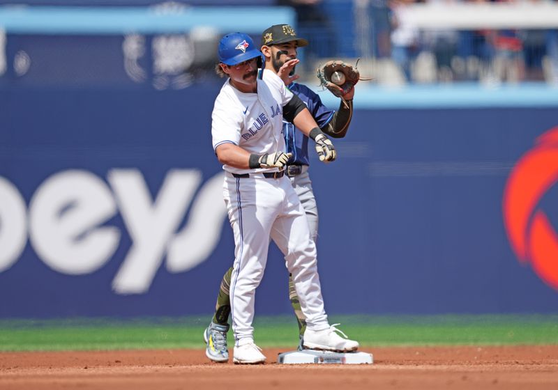 May 18, 2024; Toronto, Ontario, CAN; Toronto Blue Jays second baseman Davis Schneider (36) celebrates hitting a double during the first inning against the Tampa Bay Rays at Rogers Centre. Mandatory Credit: Nick Turchiaro-USA TODAY Sports