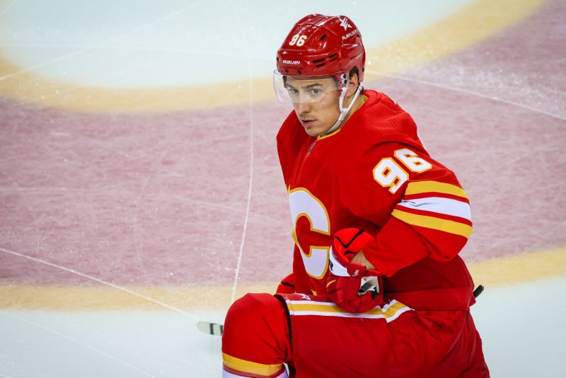 Mar 4, 2024; Calgary, Alberta, CAN; Calgary Flames left wing Andrei Kuzmenko (96) during the warmup period against the Seattle Kraken at Scotiabank Saddledome. Mandatory Credit: Sergei Belski-USA TODAY Sports