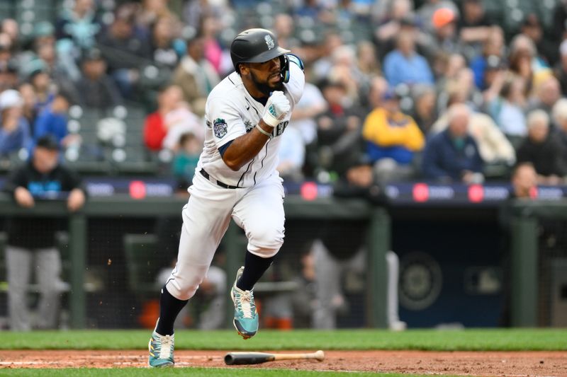 Jun 14, 2023; Seattle, Washington, USA; Seattle Mariners right fielder Teoscar Hernandez (35) runs toward first base after hitting a double against the Miami Marlins during the fourth inning at T-Mobile Park. Mandatory Credit: Steven Bisig-USA TODAY Sports