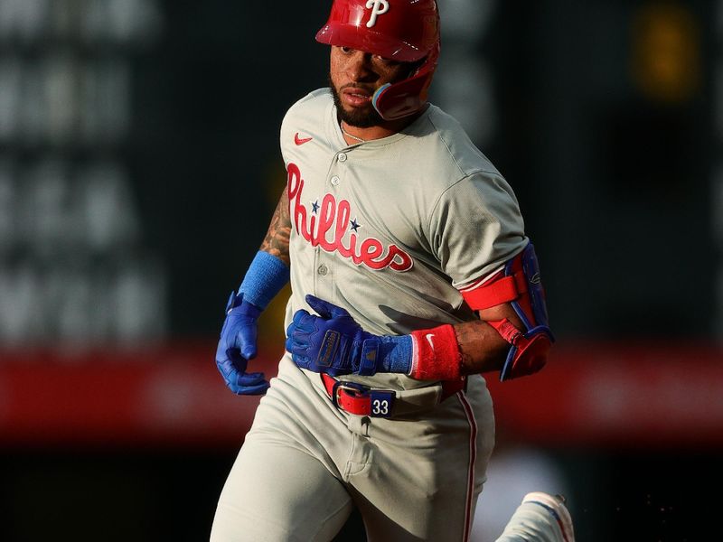 May 24, 2024; Denver, Colorado, USA; Philadelphia Phillies shortstop Edmundo Sosa (33) rounds the bases on a solo home run in the fifth inning against the Colorado Rockies at Coors Field. Mandatory Credit: Isaiah J. Downing-USA TODAY Sports