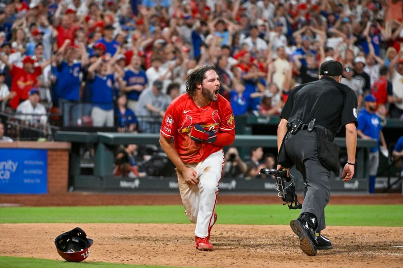 May 25, 2024; St. Louis, Missouri, USA;  St. Louis Cardinals designated hitter Alec Burleson (41) reacts after sliding safely past the tag of Chicago Cubs catcher Miguel Amaya (not pictured) during the eighth inning at Busch Stadium. Mandatory Credit: Jeff Curry-USA TODAY Sports