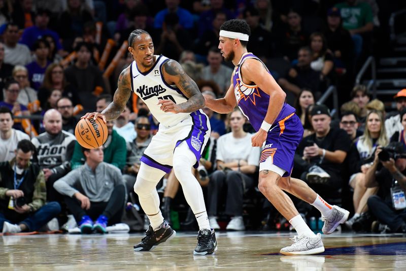 PHOENIX, ARIZONA - NOVEMBER 10: DeMar DeRozan #10 of the Sacramento Kings dribbles the ball against Devin Booker #1 of the Phoenix Suns during the second half of the NBA game at Footprint Center on November 10, 2024 in Phoenix, Arizona. NOTE TO USER: User expressly acknowledges and agrees that, by downloading and/or using this photograph, user is consenting to the terms and conditions of the Getty Images License Agreement.  (Photo by Kelsey Grant/Getty Images)