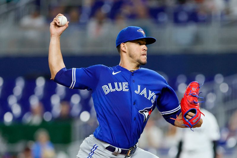 Jun 19, 2023; Miami, Florida, USA; Toronto Blue Jays starting pitcher Jose Berrios (17) delivers a pitch against the Miami Marlins during the first inning at loanDepot Park. Mandatory Credit: Sam Navarro-USA TODAY Sports