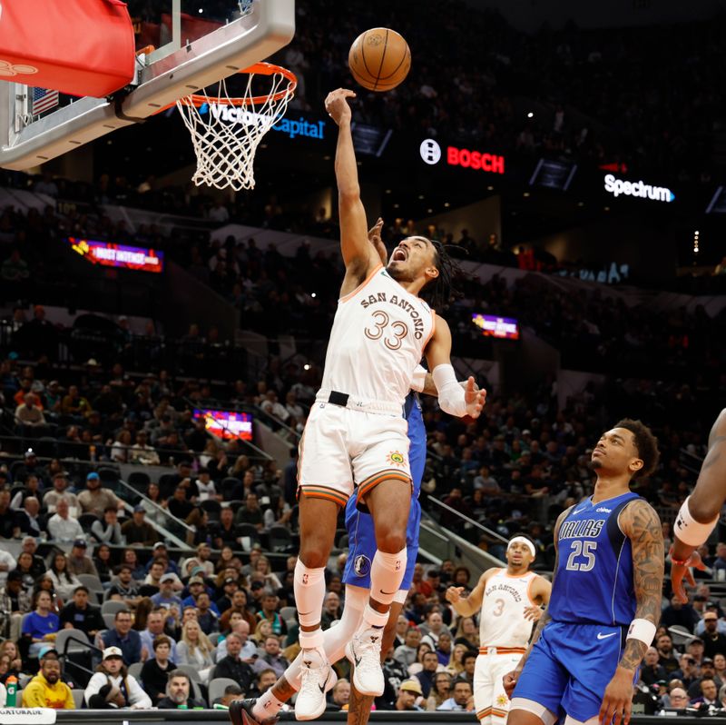 SAN ANTONIO, TX - MARCH 19:  Tre Jones #33 of the San Antonio Spurs scores on the Dallas Mavericks in the first half at Frost Bank Center on March 19, 2024 in San Antonio, Texas. NOTE TO USER: User expressly acknowledges and agrees that, by downloading and or using this photograph, User is consenting to terms and conditions of the Getty Images License Agreement. (Photo by Ronald Cortes/Getty Images)