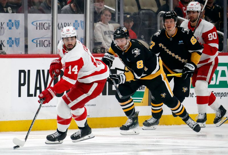 Apr 11, 2024; Pittsburgh, Pennsylvania, USA; Detroit Red Wings center Robby Fabbri (14) skates with the puck against the Pittsburgh Penguins during the first period at PPG Paints Arena. Mandatory Credit: Charles LeClaire-USA TODAY Sports