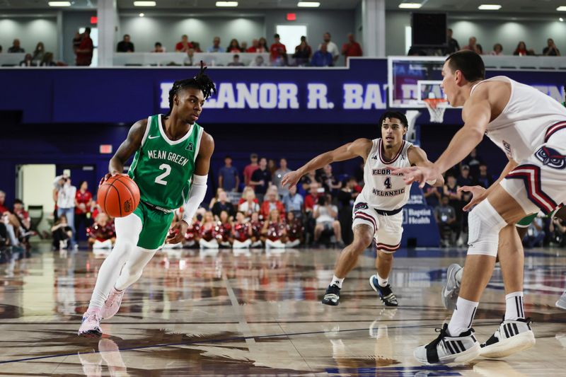 Jan 28, 2024; Boca Raton, Florida, USA; North Texas Mean Green guard Jason Edwards (2) drives to the basket against the Florida Atlantic Owls during the first half at Eleanor R. Baldwin Arena. Mandatory Credit: Sam Navarro-USA TODAY Sports