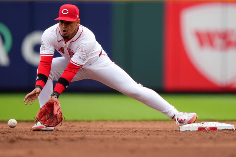 April 21, 2024; Cincinnati, Ohio, USA; Cincinnati Reds second base Santiago Espinal (4) collects a throw to begin a double play in the sixth inning of a baseball game against the Los Angeles Angels at Great American Ball Park. Mandatory Credit: Kareem Elgazzar/USA TODAY Sports via The Cincinnati Enquirer

