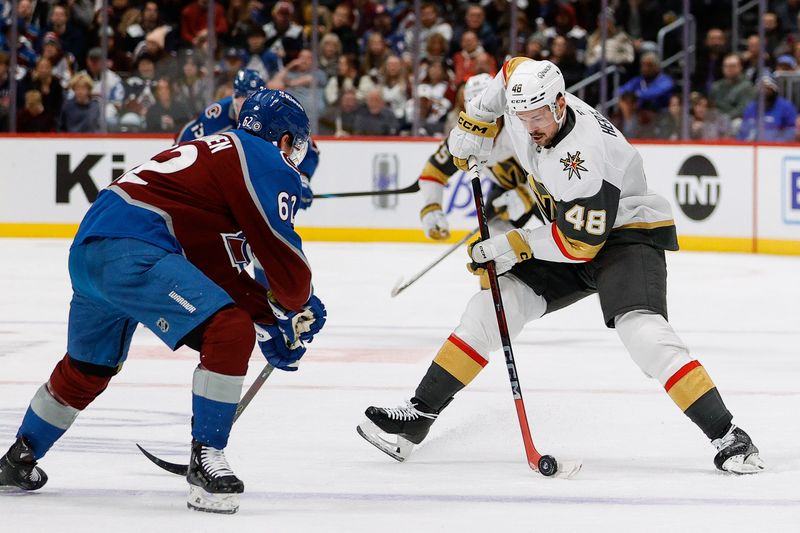 Nov 27, 2024; Denver, Colorado, USA; Vegas Golden Knights center Tomas Hertl (48) controls the puck against Colorado Avalanche left wing Artturi Lehkonen (62) in the first period at Ball Arena. Mandatory Credit: Isaiah J. Downing-Imagn Images