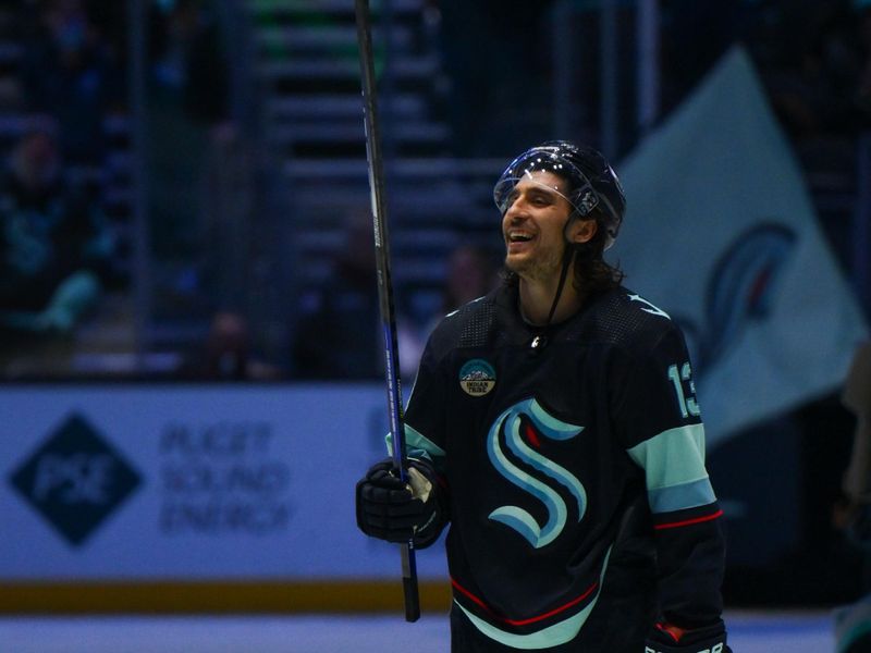 Nov 22, 2023; Seattle, Washington, USA; Seattle Kraken left wing Brandon Tanev (13) celebrates after the Kraken defeated the San Jose Sharks at Climate Pledge Arena. Mandatory Credit: Steven Bisig-USA TODAY Sports