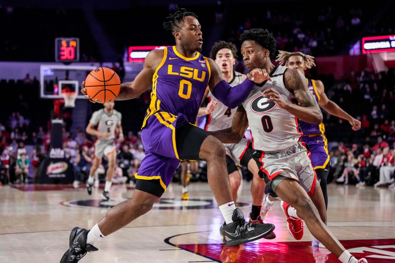 Feb 14, 2023; Athens, Georgia, USA; LSU Tigers guard Trae Hannibal (0) dribbles against Georgia Bulldogs guard Terry Roberts (0) during the first half at Stegeman Coliseum. Mandatory Credit: Dale Zanine-USA TODAY Sports