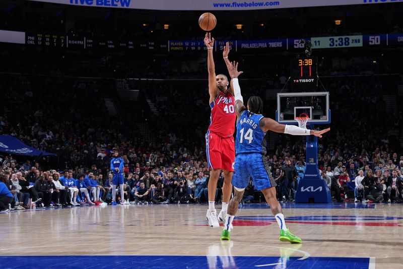 PHILADELPHIA, PA - APRIL 12: Nicolas Batum #40 of the Philadelphia 76ers shoots a three point basket during the game against the Orlando Magic on April 12, 2024 at the Wells Fargo Center in Philadelphia, Pennsylvania NOTE TO USER: User expressly acknowledges and agrees that, by downloading and/or using this Photograph, user is consenting to the terms and conditions of the Getty Images License Agreement. Mandatory Copyright Notice: Copyright 2024 NBAE (Photo by Jesse D. Garrabrant/NBAE via Getty Images)