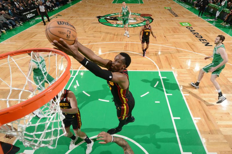 BOSTON, MA - FEBRUARY 7: Onyeka Okongwu #17 of the Atlanta Hawks rebounds the ball during the game against the Boston Celtics on February 7, 2024 at the TD Garden in Boston, Massachusetts. NOTE TO USER: User expressly acknowledges and agrees that, by downloading and or using this photograph, User is consenting to the terms and conditions of the Getty Images License Agreement. Mandatory Copyright Notice: Copyright 2024 NBAE  (Photo by Brian Babineau/NBAE via Getty Images)