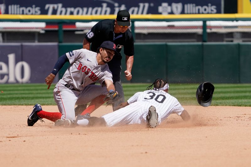 Jun 9, 2024; Chicago, Illinois, USA; Chicago White Sox outfielder Corey Julks (30) steals second base as Boston Red Sox shortstop David Hamilton (70) takes a late throw during the third inning at Guaranteed Rate Field. Mandatory Credit: David Banks-USA TODAY Sports