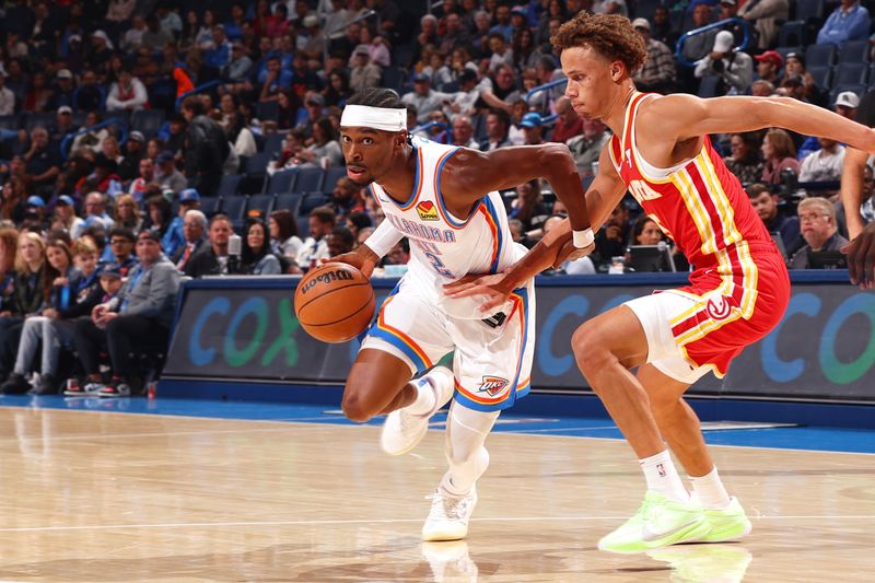 OKLAHOMA CITY, OK - OCTOBER 17: Shai Gilgeous-Alexander #2 of the Oklahoma City Thunder drives to the basket during the game against the Atlanta Hawks on October 17, 2024 at Paycom Arena in Oklahoma City, Oklahoma. NOTE TO USER: User expressly acknowledges and agrees that, by downloading and or using this photograph, User is consenting to the terms and conditions of the Getty Images License Agreement. Mandatory Copyright Notice: Copyright 2024 NBAE (Photo by Zach Beeker/NBAE via Getty Images)