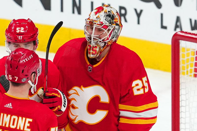 Jan 13, 2024; Las Vegas, Nevada, USA; Calgary Flames goaltender Jacob Markstrom (25) celebrates with team mates after defeating the Vegas Golden Knights 3-1 at T-Mobile Arena. Mandatory Credit: Stephen R. Sylvanie-USA TODAY Sports