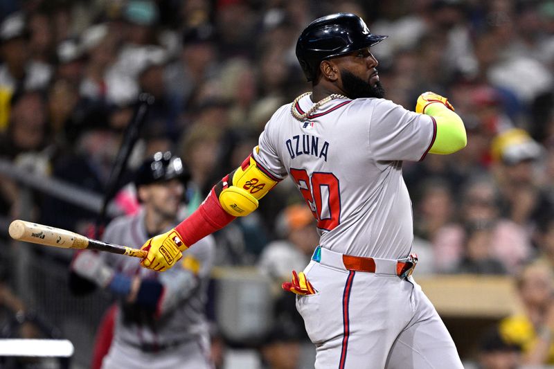 Jul 12, 2024; San Diego, California, USA; Atlanta Braves designated hitter Marcell Ozuna (20) hits a home run against the San Diego Padres during the ninth inning at Petco Park. Mandatory Credit: Orlando Ramirez-USA TODAY Sports 