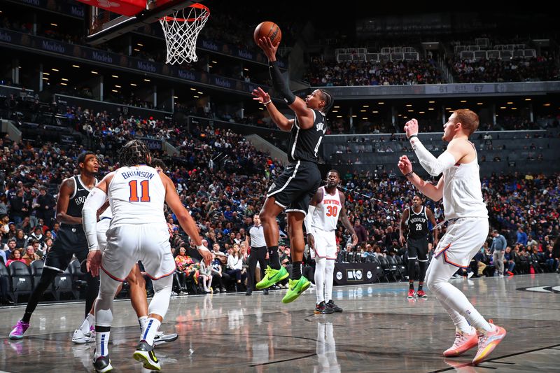 BROOKLYN, NY - JANUARY 23: Dennis Smith Jr. #4 of the Brooklyn Nets drives to the basket during the game against the New York Knicks on January 23, 2024 at Barclays Center in Brooklyn, New York. NOTE TO USER: User expressly acknowledges and agrees that, by downloading and or using this Photograph, user is consenting to the terms and conditions of the Getty Images License Agreement. Mandatory Copyright Notice: Copyright 2024 NBAE (Photo by David Nemec/NBAE via Getty Images)