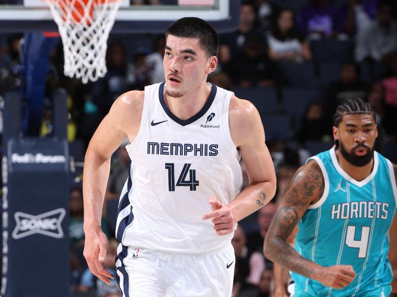 MEMPHIS, TN - OCTOBER 10: Zach Edey #14 of the Memphis Grizzlies runs up the court during the game against the Charlotte Hornets during a NBA Preseason game on October 10, 2024 at FedExForum in Memphis, Tennessee. NOTE TO USER: User expressly acknowledges and agrees that, by downloading and or using this photograph, User is consenting to the terms and conditions of the Getty Images License Agreement. Mandatory Copyright Notice: Copyright 2024 NBAE (Photo by Joe Murphy/NBAE via Getty Images)