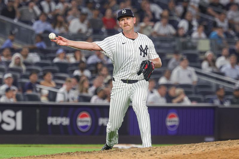Jun 5, 2024; Bronx, New York, USA; New York Yankees relief pitcher Michael Tonkin (50) throws the ball to first base for an out during the ninth inning against the Minnesota Twins at Yankee Stadium. Mandatory Credit: Vincent Carchietta-USA TODAY Sports