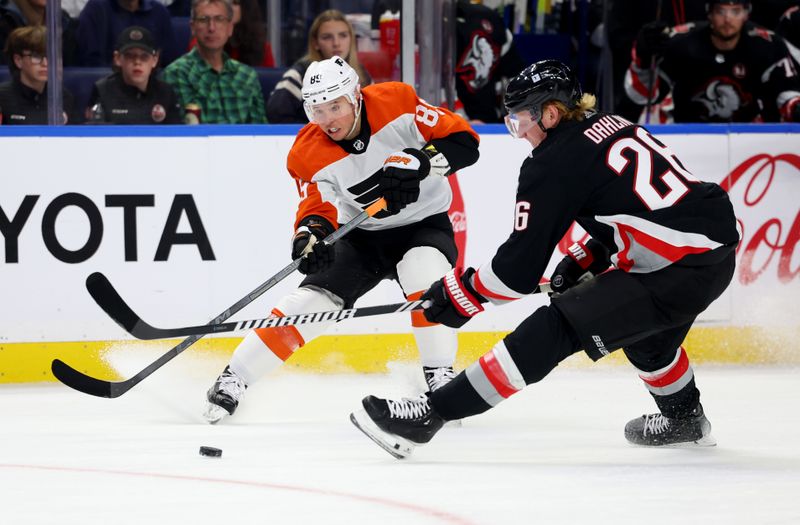 Nov 3, 2023; Buffalo, New York, USA;  Buffalo Sabres defenseman Rasmus Dahlin (26) tries to block a pass by Philadelphia Flyers right wing Cam Atkinson (89) during the first period at KeyBank Center. Mandatory Credit: Timothy T. Ludwig-USA TODAY Sports