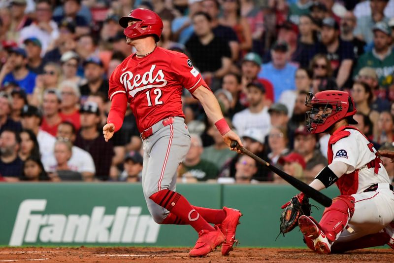 Jun 30, 2025; Boston, Massachusetts, USA; Cincinnati Reds designated hitter Austin Hays (12) hits an RBI triple during the fourth inning against the Cincinnati Reds at Fenway Park. Mandatory Credit: Bob DeChiara-Imagn Images