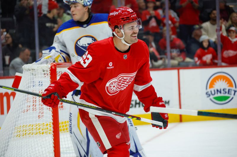 Nov 2, 2024; Detroit, Michigan, USA; Detroit Red Wings right wing Alex DeBrincat (93) looks on and smiles after  a goal in the second period of the game against the Buffalo Sabres at Little Caesars Arena. Mandatory Credit: Brian Bradshaw Sevald-Imagn Images