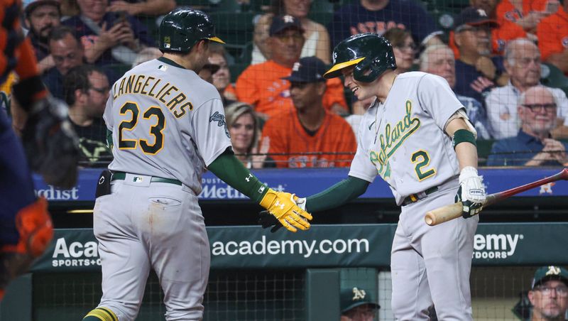 Sep 11, 2023; Houston, Texas, USA; Oakland Athletics catcher Shea Langeliers (23) celebrates with shortstop Nick Allen (2) after hitting a home run during the seventh inning against the Houston Astros at Minute Maid Park. Mandatory Credit: Troy Taormina-USA TODAY Sports