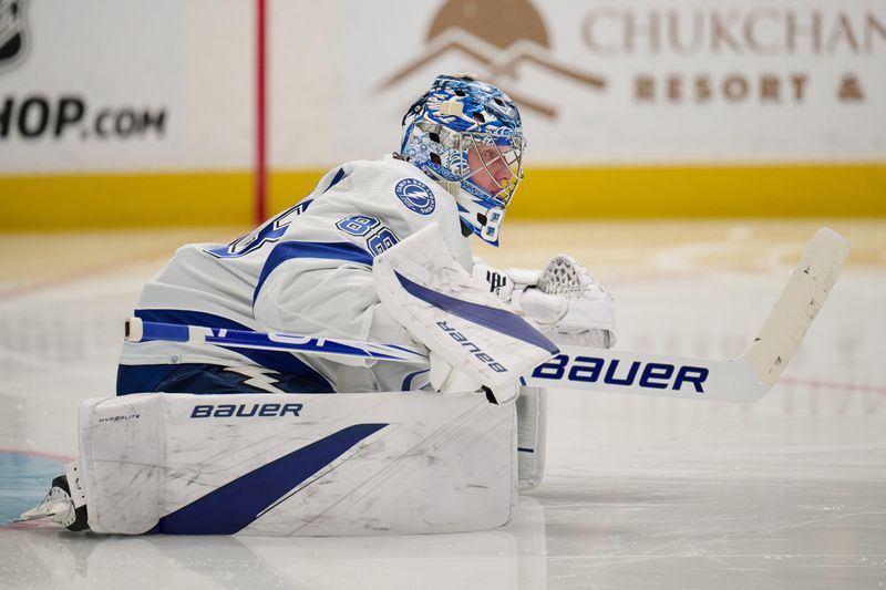 Mar 21, 2024; San Jose, California, USA; Tampa Bay Lightning goaltender Andrei Vasilevskiy (88) stretches on the ice before the start of the second period against the San Jose Sharks at SAP Center at San Jose. Mandatory Credit: Robert Edwards-USA TODAY Sports