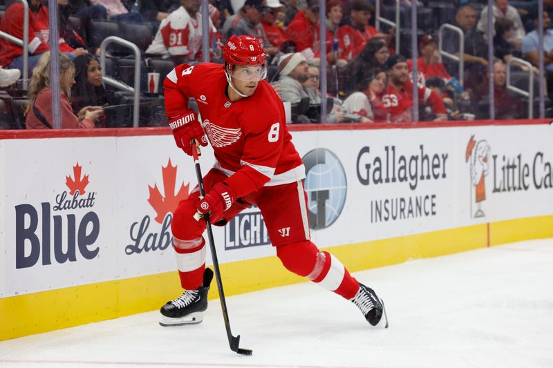 Oct 3, 2024; Detroit, Michigan, USA;  Detroit Red Wings defenseman Ben Chiarot (8) skates with the puck in the third period against the Toronto Maple Leafs at Little Caesars Arena. Mandatory Credit: Rick Osentoski-Imagn Images