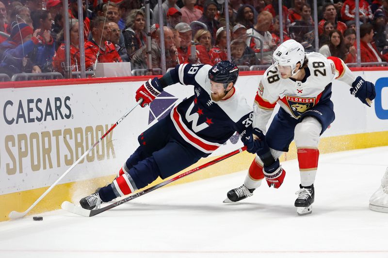 Nov 8, 2023; Washington, District of Columbia, USA; Washington Capitals right wing Anthony Mantha (39) skates with the puck as Florida Panthers defenseman Josh Mahura (28) defends in the third period at Capital One Arena. Mandatory Credit: Geoff Burke-USA TODAY Sports