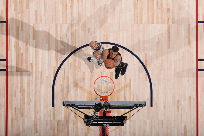 DENVER, CO - MARCH 7: Michael Porter Jr. #1 of the Denver Nuggets drives to the basket during the game against the Boston Celtics on March 7, 2024 at the Ball Arena in Denver, Colorado. NOTE TO USER: User expressly acknowledges and agrees that, by downloading and/or using this Photograph, user is consenting to the terms and conditions of the Getty Images License Agreement. Mandatory Copyright Notice: Copyright 2024 NBAE (Photo by Bart Young/NBAE via Getty Images)