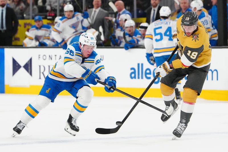 Jan 10, 2026; Las Vegas, Nevada, USA; St. Louis Blues center Otto Stenberg (28) and Vegas Golden Knights right wing Reilly Smith (19) vie for a loose puck during the first period at T-Mobile Arena. Mandatory Credit: Stephen R. Sylvanie-Imagn Images