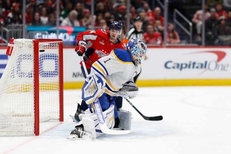 Dec 14, 2024; Washington, District of Columbia, USA; Buffalo Sabres goaltender Ukko-Pekka Luukkonen (1) is beaten by a shot from Washington Capitals right wing Tom Wilson (not pictured) as Capitals center Connor McMichael (24) looks on in the first period at Capital One Arena. Mandatory Credit: Geoff Burke-Imagn Images