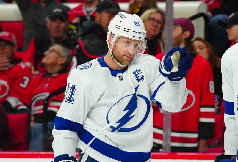 Nov 24, 2023; Raleigh, North Carolina, USA; Tampa Bay Lightning center Steven Stamkos (91) scores a goal against the Carolina Hurricanes during the second period at PNC Arena. Mandatory Credit: James Guillory-USA TODAY Sports