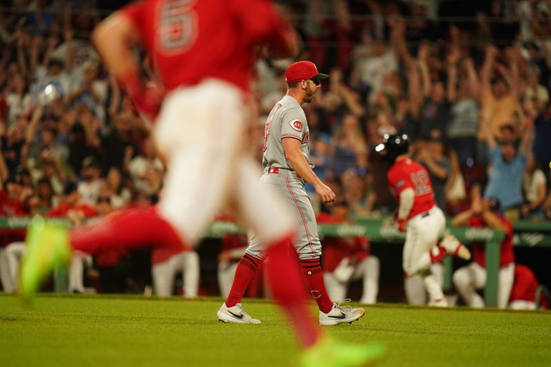 Jun 1, 2023; Boston, Massachusetts, USA; Cincinnati Reds relief pitcher Kevin Herget (57) reacts after giving up a two run home run by Boston Red Sox catcher Connor Wong (12) in the eighth inning at Fenway Park. Mandatory Credit: David Butler II-USA TODAY Sports