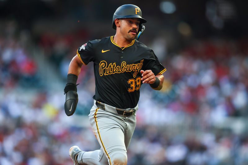 Jun 28, 2024; Atlanta, Georgia, USA; Pittsburgh Pirates second baseman Nick Gonzales (39) runs to third against the Atlanta Braves in the second inning at Truist Park. Mandatory Credit: Brett Davis-USA TODAY Sports