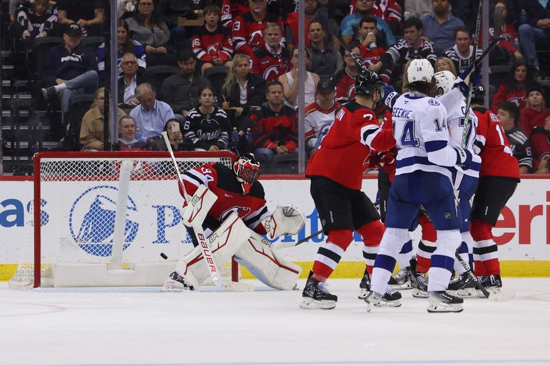 Oct 22, 2024; Newark, New Jersey, USA; Tampa Bay Lightning left wing Brandon Hagel (not shown) scores a goal against the New Jersey Devils during the second period at Prudential Center. Mandatory Credit: Ed Mulholland-Imagn Images