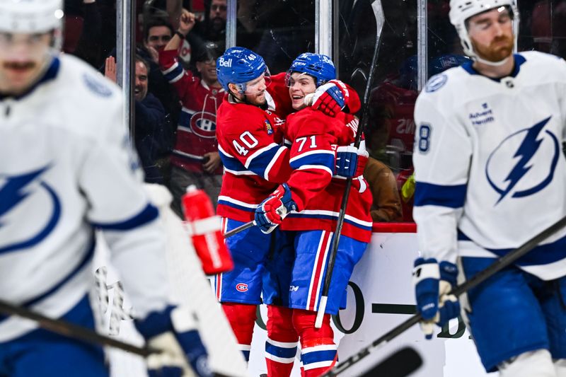 Jan 21, 2025; Montreal, Quebec, CAN; Montreal Canadiens center Jake Evans (71) celebrates with right wing Joel Armia (40) after his game winning goal during the third period against the Tampa Bay Lightning at Bell Centre. Mandatory Credit: David Kirouac-Imagn Images