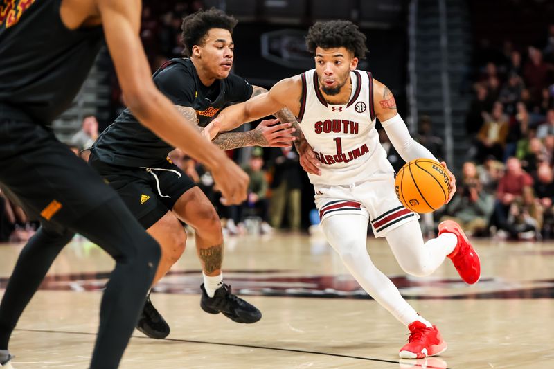 Dec 19, 2023; Columbia, South Carolina, USA; South Carolina Gamecocks guard Jacobi Wright (1) drives around Winthrop Eagles guard Kasen Harrison (11) in the second half at Colonial Life Arena. Mandatory Credit: Jeff Blake-USA TODAY Sports