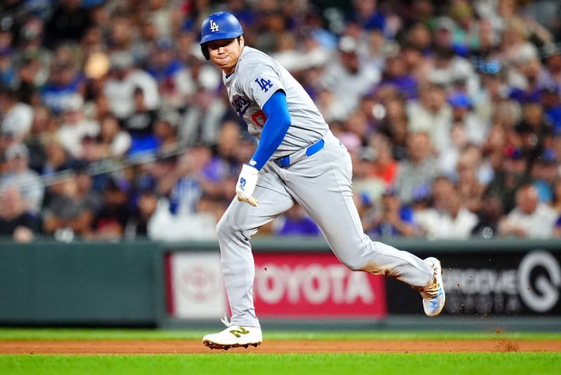 Sep 28, 2024; Denver, Colorado, USA; Los Angeles Dodgers designated hitter Shohei Ohtani (17) attempts to steal second base in the fifth inning against the Colorado Rockies at Coors Field. Mandatory Credit: Ron Chenoy-Imagn Images