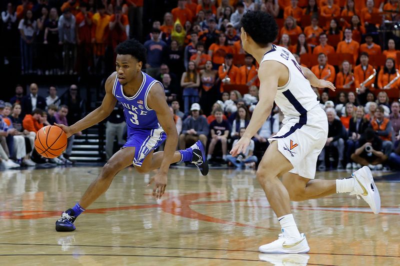 Feb 11, 2023; Charlottesville, Virginia, USA; Duke Blue Devils guard Jeremy Roach (3) drives to the basket as Virginia Cavaliers guard Kihei Clark (0) defends in the first half at John Paul Jones Arena. Mandatory Credit: Geoff Burke-USA TODAY Sports