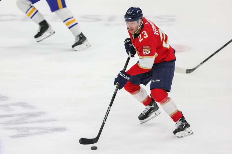 Feb 27, 2024; Sunrise, Florida, USA; Florida Panthers center Carter Verhaeghe (23) moves the puck against the Buffalo Sabres during the first period at Amerant Bank Arena. Mandatory Credit: Sam Navarro-USA TODAY Sports